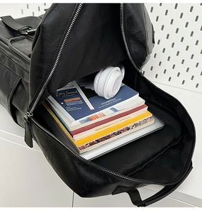 Internal view of large capacity leather backpack with laptop and books storage