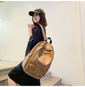 Outdoor shot of a vintage brown large capacity backpack with textured retro finish