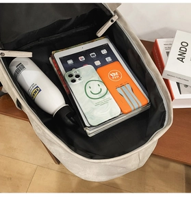 Detailed view of the large capacity interior with padded laptop compartment and organizers