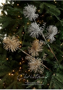 Sparkly gold Christmas pick with glitter starburst and spiral detail on festive tree