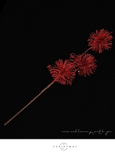 Detail of red Christmas pick with glitter pom-poms for festive holiday tree decoration