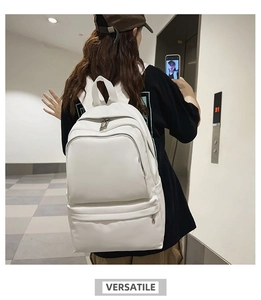 Versatile white fashion backpack shown from side view on model with multi-pocket design