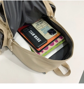 Internal view of the large capacity apricot backpack with multiple compartments