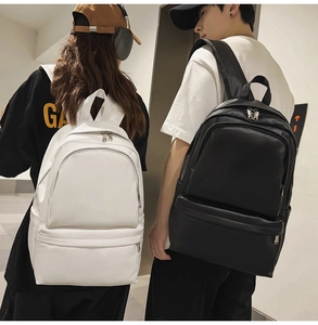 Detail view of large capacity black and white backpacks with durable multi-zipper layers
