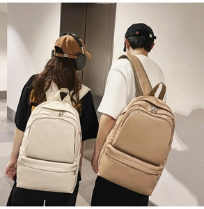 Minimalist beige and brown nylon backpacks with large capacity and multi-pocket design