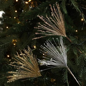 Sparkling Christmas glitter tree picks in gold and silver set in festive branch greenery