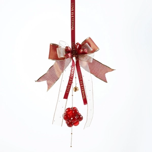 Red bow ornament with transparent acrylic beads and gold bells for Christmas tree decor