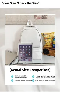Detail view of large capacity white backpack showing interior space for tablet and A4 magazines