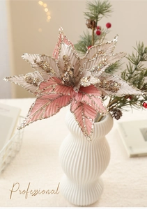 Detail of pink and champagne artificial Christmas flower with glitter edges in a vase