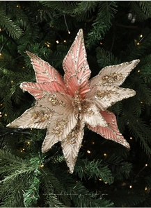 Close-up of champagne pink poinsettia ornament with glitter and sequins on Christmas tree