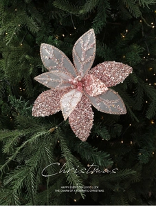 Close-up of rose gold Christmas flower ornament with mesh petals and glitter detailing