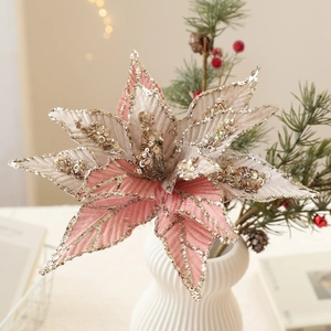 Champagne pink Christmas poinsettia flower with gold sequins for holiday tree decor