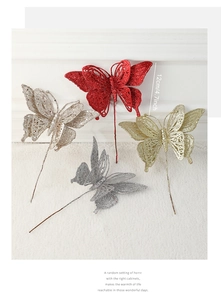 Close-up of 12cm glitter butterfly picks in gold, silver, red, and champagne for trees