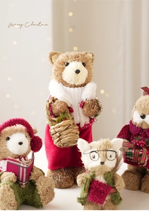 Handcrafted straw Christmas figurines with knitted outfits for rustic holiday decor