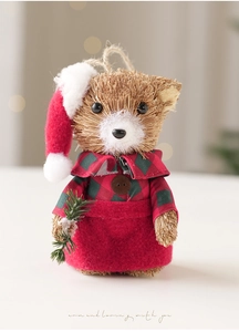 Detail of straw woven Christmas bear with red plaid dress and pine branch accent