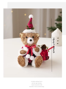 Detail of 7-inch straw woven Christmas teddy bear with red cape and pine cone decor