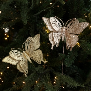 Glittery butterfly Christmas tree ornaments in gold and champagne with hollow carving