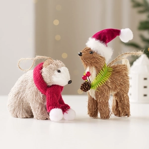 Set of straw Christmas polar bear and deer ornaments with red festive scarves and berries