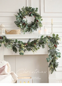 Detailed snowy Christmas wreath and garland set with pine cones and eucalyptus leaves