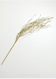Close-up of golden glitter wheat stalks decoration with sparkling sequins and wired stem