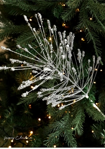 Close-up of glittery silver Christmas tree picks with shimmering metallic sequin finish