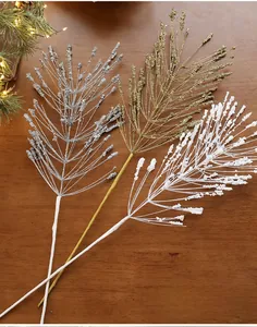 Close-up of sparkling silver, gold, and white glitter branches for Christmas decoration