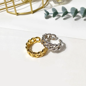 Polished silver and gold chunky chain link rings with adjustable open design on white background