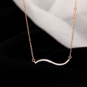 Detailed view of wave-shaped S925 silver necklace with sparkling pavé zircons