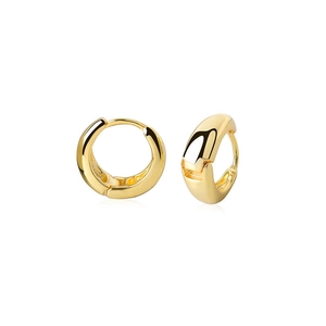 Macro detail of thick 18K gold plated hoop earrings with a polished glossy finish