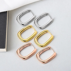 Polished chunky U-shaped hoop earrings in gold, silver, and rose gold finish