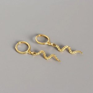 Elegant gold snake hoop earrings with detailed scale texture in a minimalist design