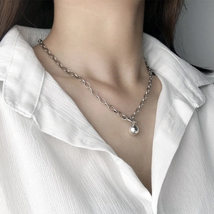 Minimalist silver polished necklace featuring a solid round bead pendant on a paperclip chain