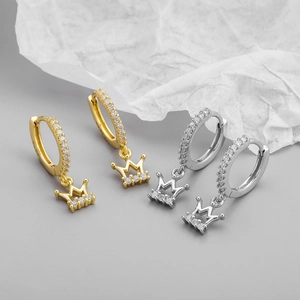 Macro detail of S925 sterling silver stamp on crown earrings with zircon pavé