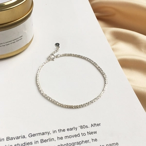 Detailed view of S925 sterling silver shimmering chain with adjustable extender and tag
