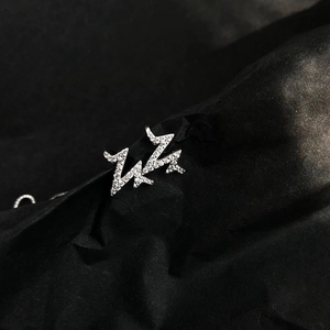 Macro shot of silver lightning stud earrings with sparkling micro-paved cubic zirconia stones