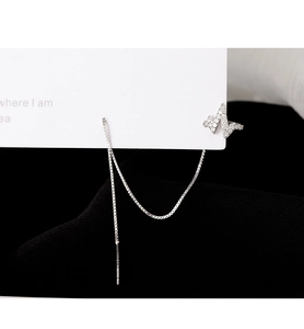S925 sterling silver lightning wave ear cuff with zircon tassel chain on black background