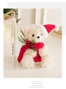 Close-up of a 15cm Christmas teddy bear with red hat and scarf in a festive setting