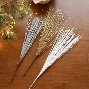 Glittery Christmas spray branches in gold silver and white for holiday tree decoration