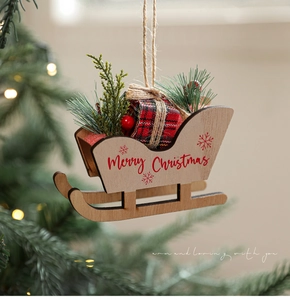 Detail of wooden Christmas sled ornament with red plaid gift box and berries on tree