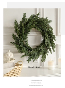 Detailed view of 80cm cedar Christmas wreath on a mantle with elegant white interior decor