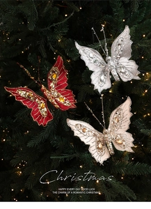 Detail of glittery butterfly ornaments with sequins and pearls on a Christmas tree
