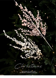 Detail of pink and white glittery Christmas berry stems with a pearlescent finish
