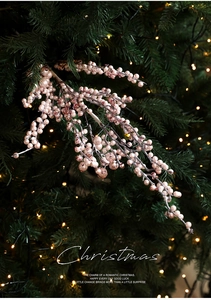 Detail of pink glitter Christmas berry picks with pearl texture on holiday tree