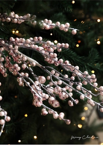 Macro detail of sparkling pink glitter berries and sequins for Christmas tree decoration