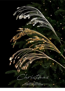 Macro detail of glittery gold and silver Christmas spray branches with festive bokeh