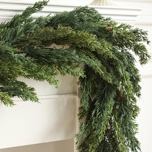 Lush pine needle garland for Christmas fireplace decor with natural green texture