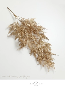 Détail de branches de pin artificielles dorées à paillettes pour décor de Noël