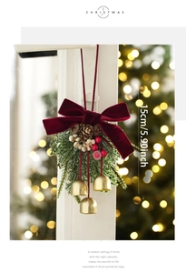 Christmas decoration featuring red velvet bow, pine cones, and gold bells, 15cm height