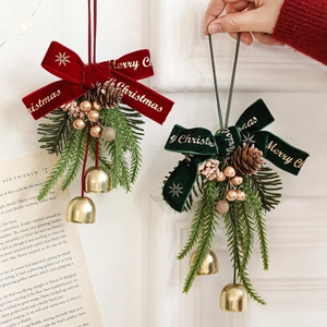 Christmas bow pendant with bells pine cones and embroidery on festive holiday decor