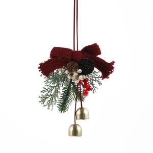 Christmas hanging ornament with red velvet bow pine cones and golden bells decoration